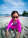 Little asian girl playing on the beach. Vacation and relaxing concept Royalty Free Stock Photo