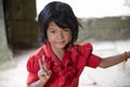 Little asian girl posing in Angkor Wat temple