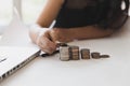 little asian girl put coin to money stack - money saving education concept