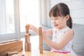 Girl smiling while playing wooden blocks on table Royalty Free Stock Photo