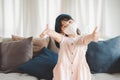 little Asian girl smiling wearing face mask show thumb up gesture Royalty Free Stock Photo