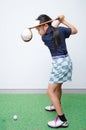 Little asian girl takine golf club training Royalty Free Stock Photo