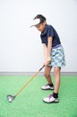 Little asian girl takine golf club training Royalty Free Stock Photo