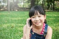 Little asian girl talking on cell phone Royalty Free Stock Photo