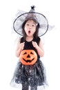 Little asian girl wearing witch costume for Halloween holding pu Royalty Free Stock Photo