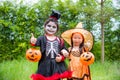 Girls in Halloween costume standing in park