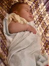 Little Asian infant baby girl sleeping in fabric cradle Royalty Free Stock Photo