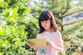 Asian kid girl using tablet watching video. Royalty Free Stock Photo