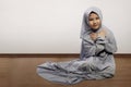 Little asian muslim kid wearing veil praying Royalty Free Stock Photo