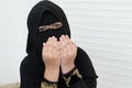 Little Asian Pakistani Muslim girl wearing black hijab with beautiful eyes is praying to god Royalty Free Stock Photo