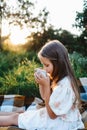 Little attractive girl enjoying tea Royalty Free Stock Photo