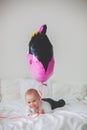 Little baby boy with big balloon, sitting on the floor Royalty Free Stock Photo