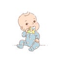 Little baby boy in blue pajamas sit, hold teething ring