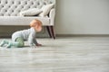 Little baby boy crawling on floor at home Royalty Free Stock Photo