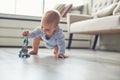 Little baby boy crawling on floor at home Royalty Free Stock Photo