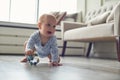 Little baby boy crawling on floor at home Royalty Free Stock Photo