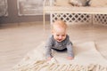 Little baby boy crawling on the floor at home Royalty Free Stock Photo