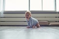 Little baby boy crawling on floor at home Royalty Free Stock Photo