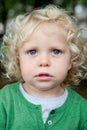 Little baby boy with curl hair and blue eyes Royalty Free Stock Photo