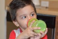 Little baby boy drinking milk on his green bottle Royalty Free Stock Photo