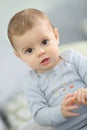 Little baby boy eating a biscuit Royalty Free Stock Photo