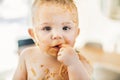 Little baby boy eating her dinner and making a mess Royalty Free Stock Photo