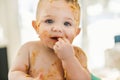 Little baby boy eating her dinner and making a mess Royalty Free Stock Photo