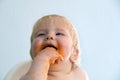 Little baby boy eating spaghetti bolognese. Cute kid making a mess Royalty Free Stock Photo