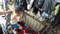 Little baby boy on motorcycle mimics driving