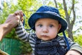 Little baby boy in park holding father hands Royalty Free Stock Photo