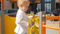 Little baby boy playing with colorful abacus and bricks on the playground. Children developments, kids education, baby learning Royalty Free Stock Photo