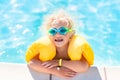 Little baby boy playing in swimming pool Royalty Free Stock Photo