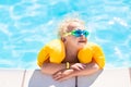 Little baby boy playing in swimming pool Royalty Free Stock Photo