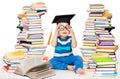 Little Baby Boy Reading Books. Happy Smiling Child in Graduation Cap Studying. Funny Kid in Glasses sitting next to Stack of Books Royalty Free Stock Photo