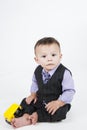 Little baby boy sitting on the floor Royalty Free Stock Photo