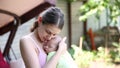 Little baby boy sleeping on mom`s chest outdoor