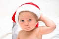 Little baby boy smiling face with red santa hat. One year old kid in christmas costume, christmas time concept Royalty Free Stock Photo