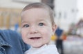 Little baby boy smiling and showing his first teeth Royalty Free Stock Photo