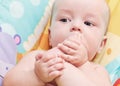 A little baby boy sucking toes on her feet Royalty Free Stock Photo