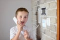 Little baby boy talking on intercom Royalty Free Stock Photo