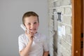 Little baby boy talking on intercom Royalty Free Stock Photo