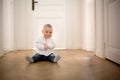 Little baby boy, toddler, in a long hall, crawling on the floor Royalty Free Stock Photo