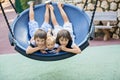 Little baby child, toddler boy, swinging on a swing in the park Royalty Free Stock Photo