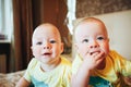 Infant Baby Child Twins Brothers Six Months Old at Home on the Bed