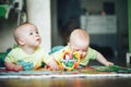 Infant Baby Child Twins Brothers Six Months Old is Playing on the Floor Royalty Free Stock Photo