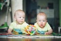 Infant Baby Child Twins Brothers Six Months Old is Playing on the Floor Royalty Free Stock Photo