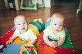 Infant Baby Child Twins Brothers Six Months Old is Playing on the Floor Royalty Free Stock Photo