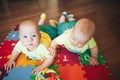 Infant Baby Child Twins Brothers Six Months Old is Playing on the Floor Royalty Free Stock Photo