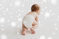 Little baby in diaper crawling on white floor Royalty Free Stock Photo