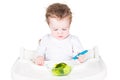 Little baby eating broccoli Royalty Free Stock Photo